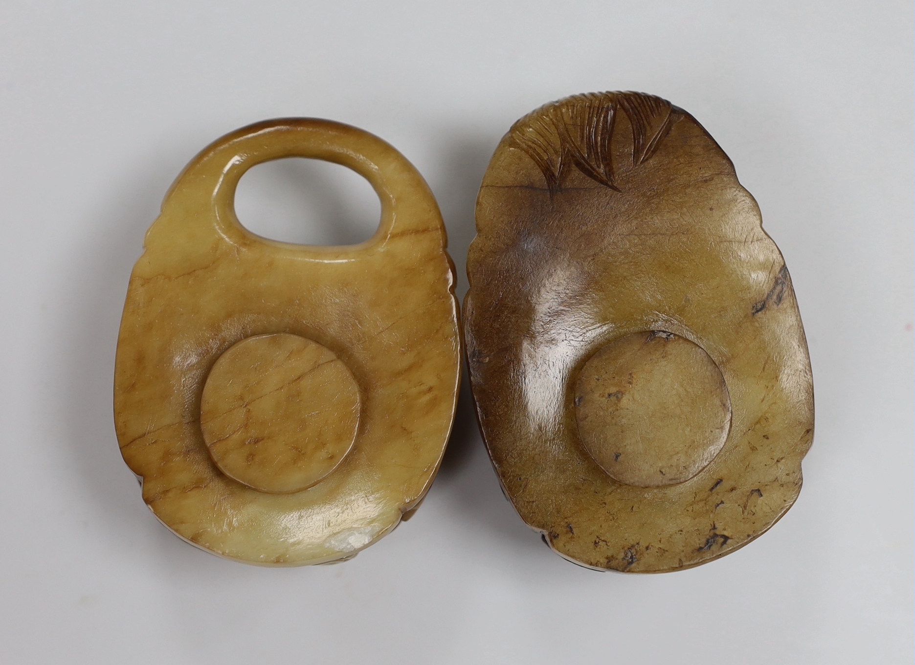 A Chinese cream and russet jade two piece belt buckle, 17th century